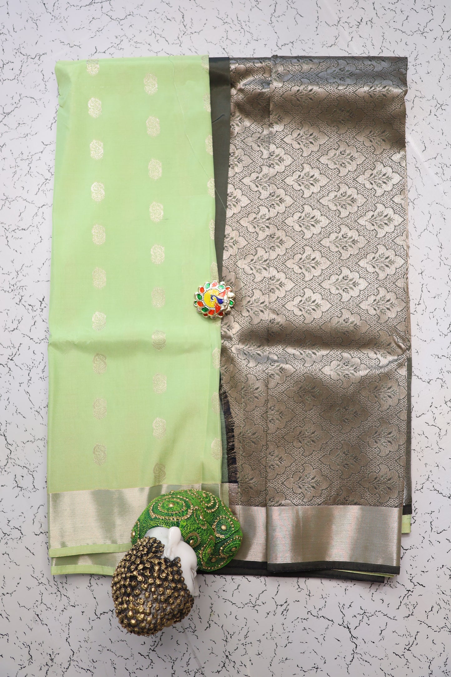 Festive and wedding wear pastel shade pista green semi silk saree with silver zari and Mehndi green pallu