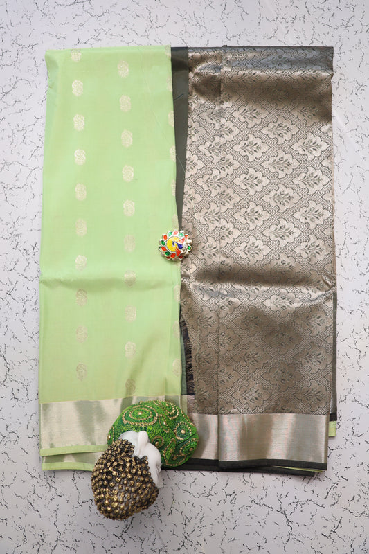 Festive and wedding wear pastel shade pista green semi silk saree with silver zari and Mehndi green pallu
