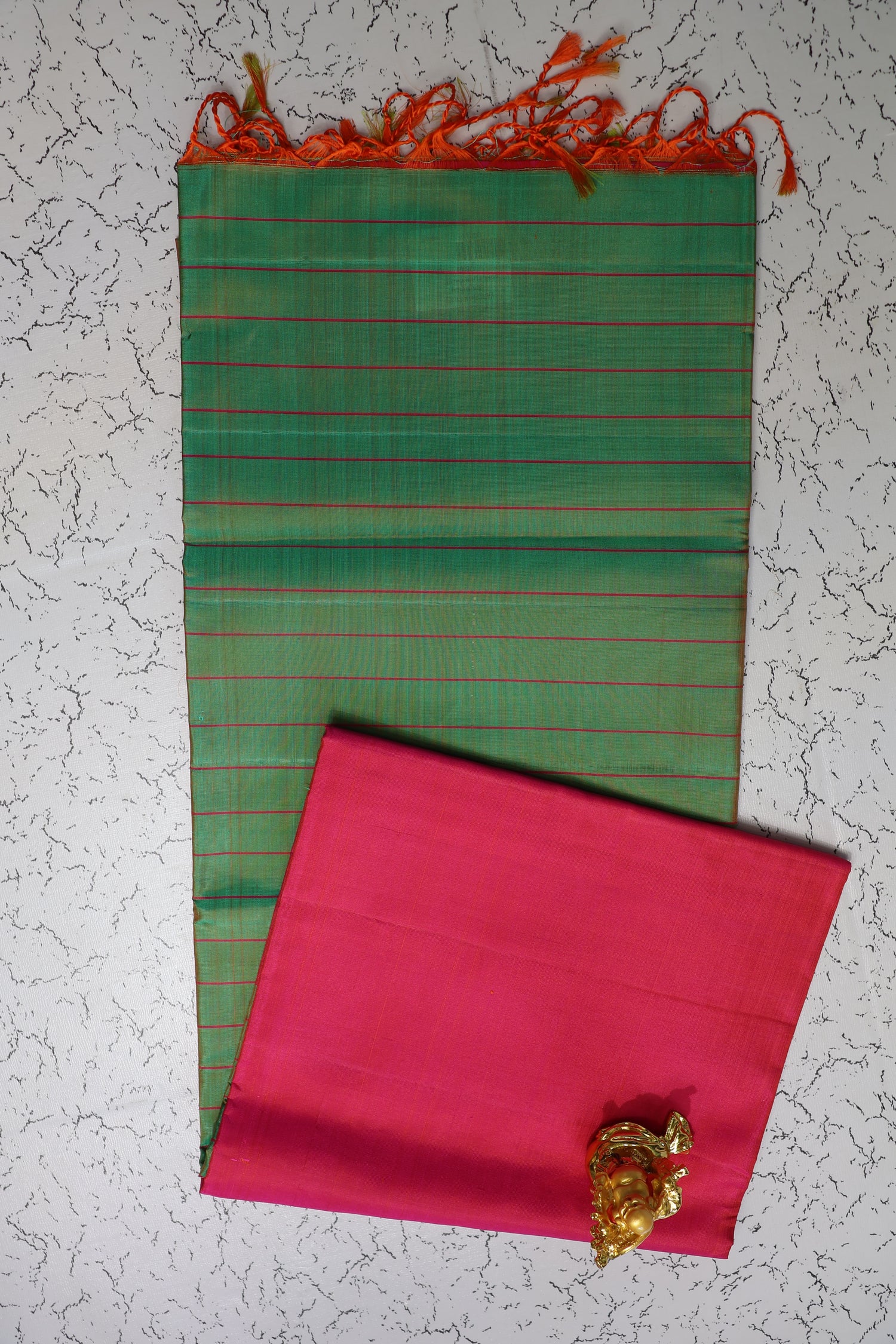 Light weight Pure Silk Saree green body with the vibrant Rani pink pallu.