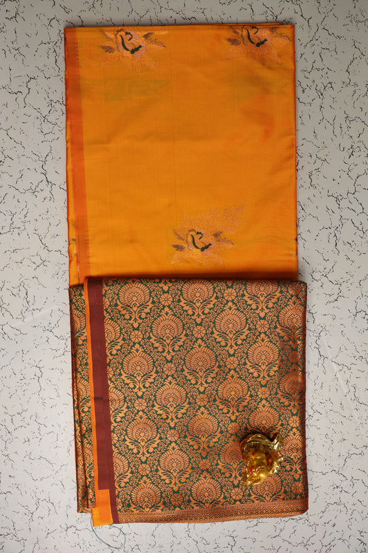 Traditional yellow soft silk saree without border and green pallu